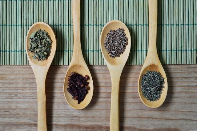 A photo of 4 wooden kitchen spoons.