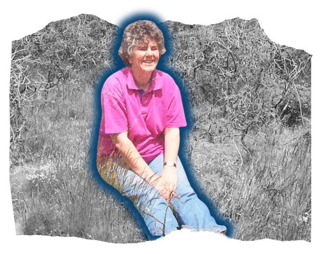 Liz sat smiling in long grass