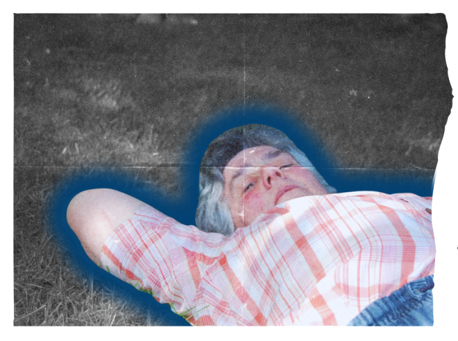 liz laying down on grass, relaxing.