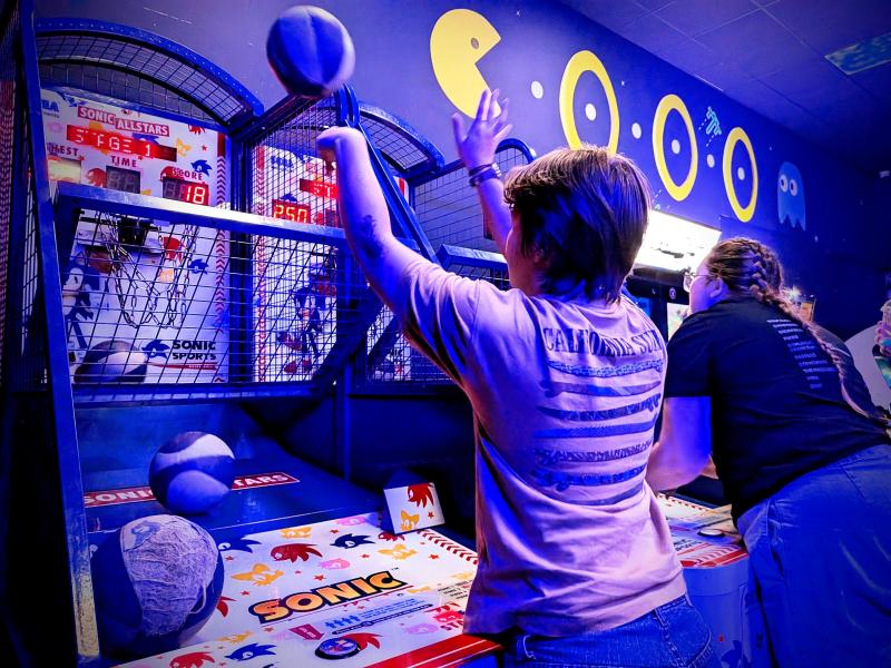 member playing basketball in an arcade