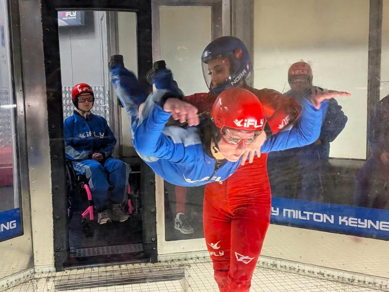 member doing an indoor skydive